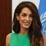 amal-clooney-stuns-in-emerald-green-dress-during-outing-to-new-york’s-un-headquarters:-photos