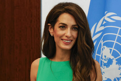 amal-clooney-stuns-in-emerald-green-dress-during-outing-to-new-york’s-un-headquarters:-photos