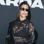 kourtney-kardashian-stuns-in-black-bodysuit-&-fur-coat-at-family-christmas-party-just-2-months-after-giving-birth