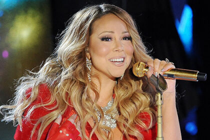 mariah-carey-steps-into-a-hot-tub-in-a-plunging-red-sequin-gown-to-ring-in-2024:-watch