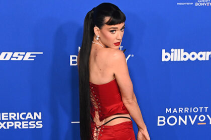 katy-perry-shows-off-g-string-in-red-lace-up-outfit-at-the-2024-billboard-women-in-music-awards:-photos