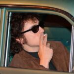 timothee-chalamet-smokes-a-cigarette-on-the-set-of-bob-dylan-movie-in-new-video